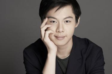 Han Chen on a gray background